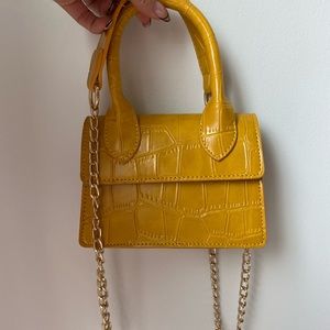 Cute faux leather croc material hand bag in yellow